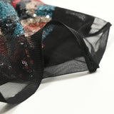 Tulle Sequin Young Red Corail rojo y fondo negro de pato