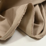 Sergé de coton élasthanne satiné beige