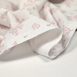 Coton imprimé petite brousse rose fond blanc