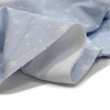 Estrellas de estampado de algodón Fondo azul claro