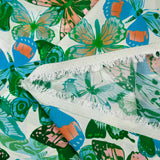 Viscose imprimée jacquard papillons bleus et verts fond blanc