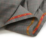 100% Prince of Wales wool suit fabric, black, red, off-white background