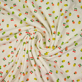 Jersey pointelle coton imprimé tutti frutti fond blanc cassé