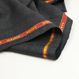 100% Prince of Wales wool tailoring fabric, black, blue, dark gray background