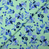 Popeline de coton imprimée fleur bleu roi fond vert jade