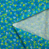 Popeline de coton imprimée bourgeon jaune et bleu fond turquoise