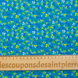 Popeline de coton imprimée bourgeon jaune et bleu fond turquoise