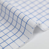 Popeline polycoton jacquard à carreaux bleu denim fond blanc