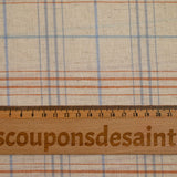 Woven cotton dyed sky and brown checks mottled beige background