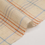 Woven cotton dyed sky and brown checks mottled beige background