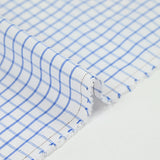 Popeline polycoton tissée-teinte à carreaux Arthur bleu fond blanc