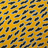 Popelín de algodón ORGÁNICO estampado con fondo amarillo rayo