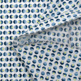 Coton élasthanne lever du soleil en pois fond blanc