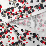 Satin de coton élasthanne dans les bulles rouge fond blanc