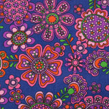 Cotton corduroy printed with psychedelic flowers indigo background