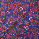 Cotton corduroy printed with psychedelic flowers indigo background