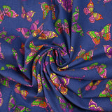 Cotton corduroy printed with butterflies indigo background