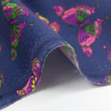 Cotton corduroy printed with butterflies indigo background