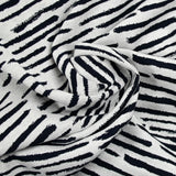 Jersey de coton tissé teint fantaisie marine fond blanc