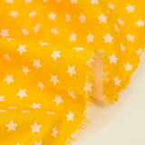 Coton imprimé étoile 1cm jaune