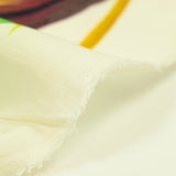 Voile de coton imprimé jungle vert fond blanc cassé