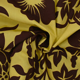 Cotton printed with giant brown flowers on anise green background