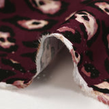 Twill de viscose imprimé léopard graou fond lie de vin