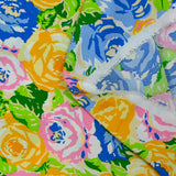 Viscose imprimée montagne de fleurs orange, bleu et vert