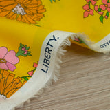 Coton liberty ® Tropical Sprig fond jaune au mètre