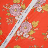 Coton liberty ® Tropical Sprig fond corail au mètre
