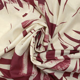 Voile de coton imprimé traces de feuilles fond bordeaux