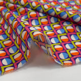 Viscose imprimée cercle vintage fuchsia fond violet