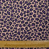 Coton imprimé léopard violet fond rose chair