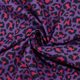 Coton imprimé léopard fuchsia fond violet