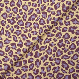 Coton imprimé léopard violet fond jaune beurre