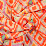 Viscose imprimée losange orange fond parme