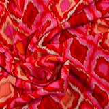 Viscose imprimée losange rose fond rouge