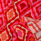 Viscose imprimée losange rose fond rouge
