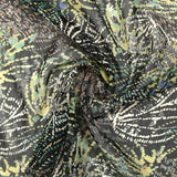 Mousseline imprimée lurex feu d'artifice vert sauge fond noir