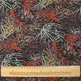 Mousseline imprimée lurex feu d'artifice brique et ocre fond noir