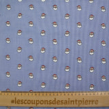 Coton tissé teint imprimé le père Noël fond blanc et bleu