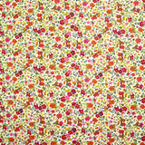 Coton imprimé Greta fleurs fuchsia et orange fond blanc au mètre