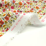 Cotton printed Greta Flowers Fuchsia and Orange White background per meter