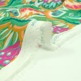 Coton imprimé Ginevra rose et orange fond vert au mètre