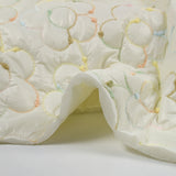 Matelassé brodé fleurs multicolores fond écru