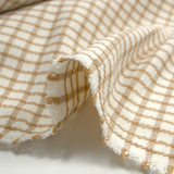 Polyester élasthanne à carreaux camel fond blanc cassé