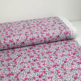 Coton imprimé Anna fleurs rose et fuchsia fond blanc au mètre