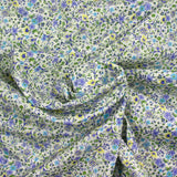 Flores moradas de Giorgia de algodón y fondo azul ECRU por metro