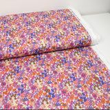 Coton imprimé Matilde fleurs corail et lavande au mètre