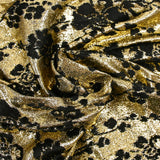 Maille lurex fleurs noires velours fond doré